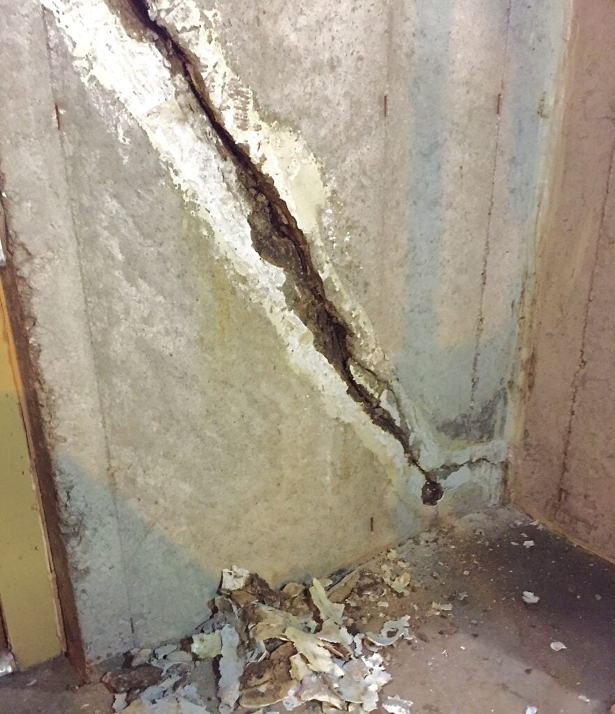 A basement crack that has been cleaned and prepared for carbon fiber repair